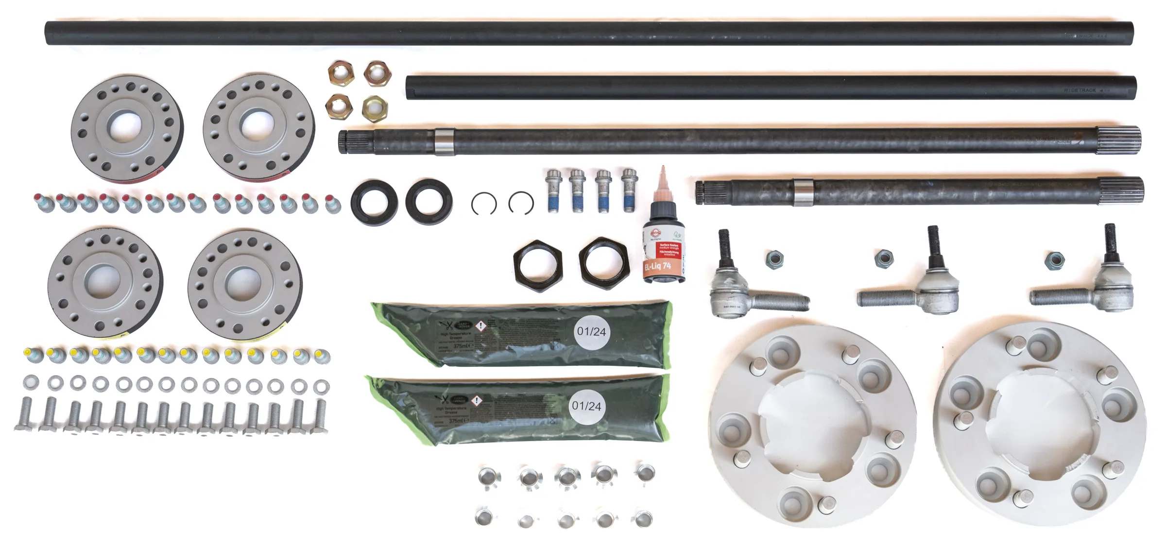 Complete scope of delivery of the Widetrack axle widening kit laid out on a white background